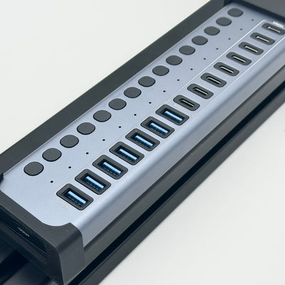 Acasis Mount for HB16Pro and HB16Max USB hubs, shown with the hub fitted to the bracket. This dedicated sim racing hub holder provides a defined mounting position for cable organisation on an aluminium profile rig. The design helps keep the hub with the cockpit, making it easier to plan cable routes between racing peripherals and the USB connections used for the setup.